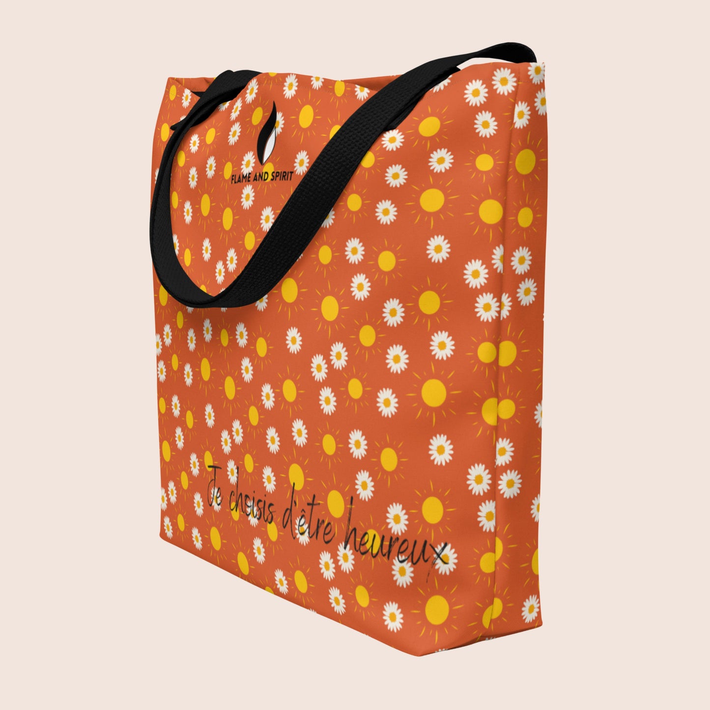 Tote bag unisexe, avec affirmation positive en bas de la face avant. Motifs soleils et pissenlits sur fond orange. Signature Flame and Spirit face avant et poche intérieure.