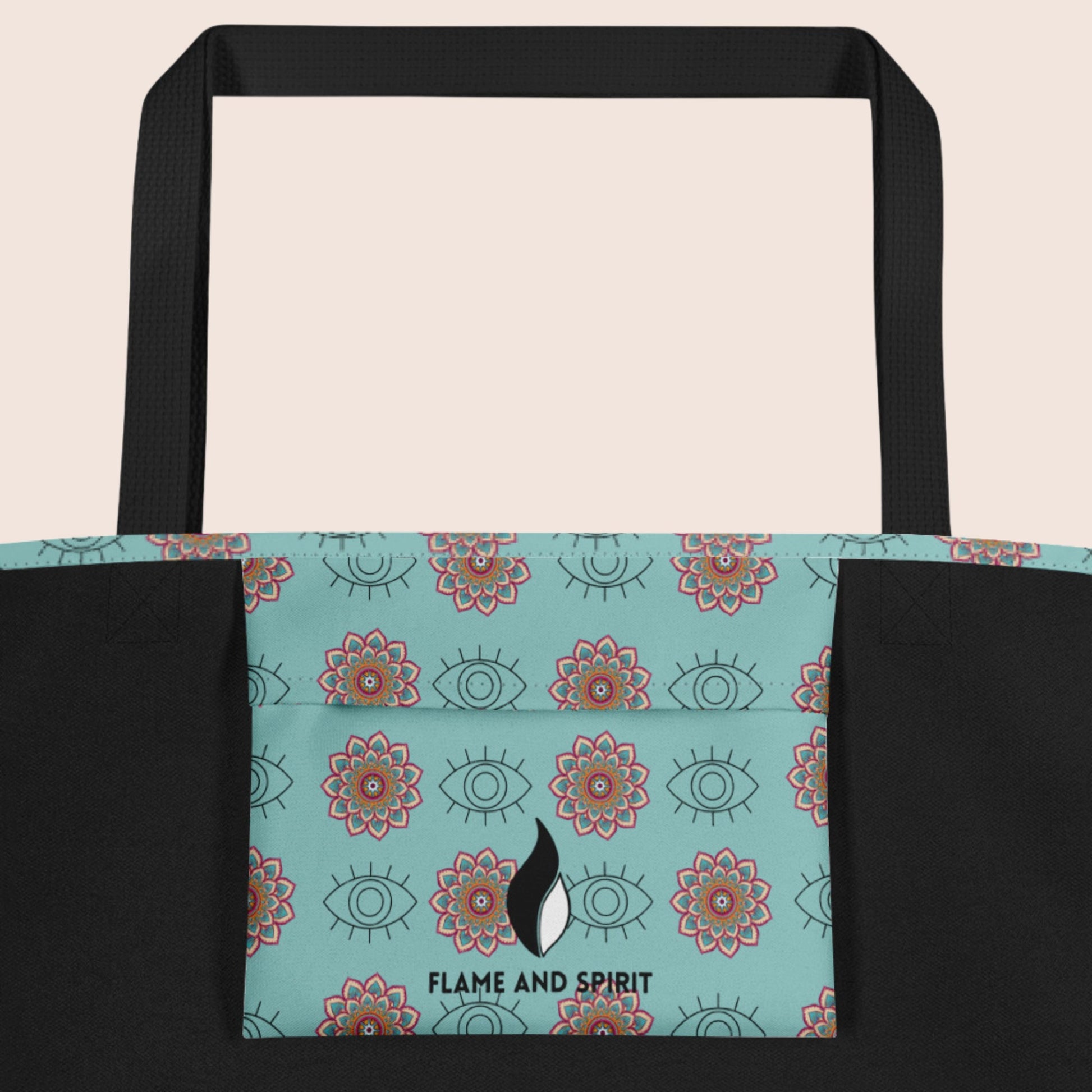 Tote Bag non genré, avec affirmation positive sur face avant. Motifs œil graphique et mandala sur fond bleu vert clair. Signature Flame and Spirit face avant et poche intérieure.